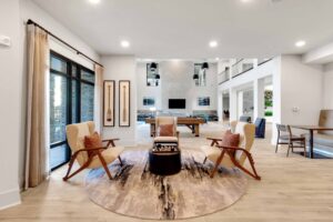 Modern open-concept living space with comfortable seating, natural light, and stylish decor.